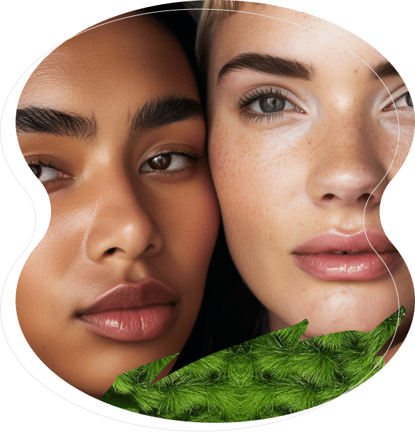 Two women with clear skin and natural makeup pose closely together, highlighting beautifully shaped brows from microblading and nanobrows, with a green textured leaf partially visible in the foreground.