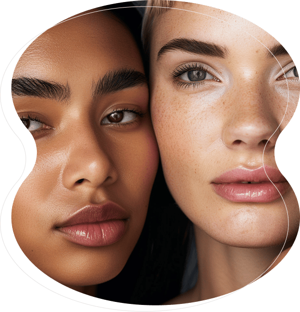 Close-up of two women with clear skin and natural makeup, positioned closely together, showcasing flawless brows enhanced by microblading and nanobrows, as they face the camera.